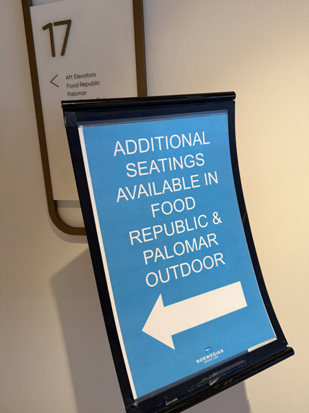 Sign that reads "additional seating available in Food Republic and Palomar Outdoor"