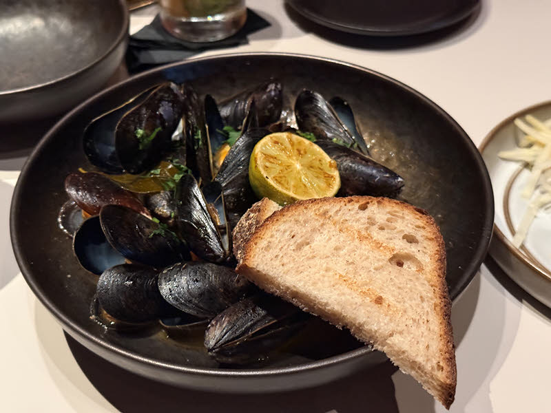 Goan Curried Mussels - coconut-masala curry, grilled sourdough, cilantro
